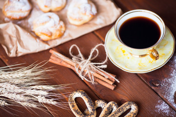 Beautiful set of bakery products and vintage cup of tea. Flat lay composition of breakfast food on the wooden background. Food, break, cooking, lifestyle concept. Top view. Close up.