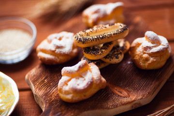 Beautiful set of bakery products and vintage cup of tea. Flat lay composition of breakfast food on the wooden background. Food, break, cooking, lifestyle concept. Top view. Close up.