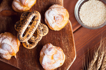 Beautiful set of bakery products and vintage cup of tea. Flat lay composition of breakfast food on the wooden background. Food, break, cooking, lifestyle concept. Top view. Close up.