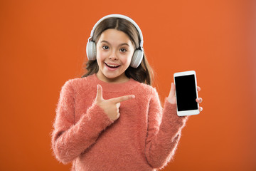 Best music apps that deserve a listen. Girl child listen music modern headphones and smartphone. Listen for free. Get music family subscription. Access to millions of songs. Enjoy music concept
