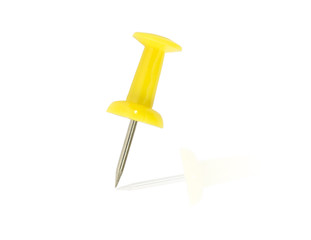 Yellow pushpin close up on an isolated background.