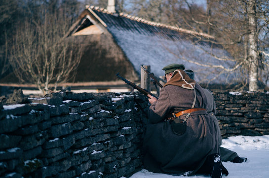 Side view of Estonian soldiers shooting in the Estonian War of Independence.