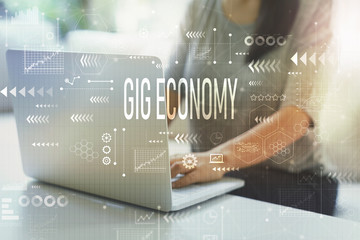 Gig economy with woman using her laptop in her home office