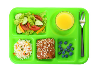 Serving tray with healthy food on white background, top view. School lunch
