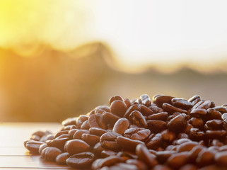 Close up Arabica roasted coffee beans Outdoor shooting with sunlight and blur background