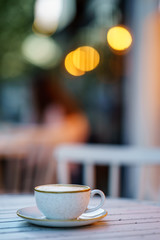 Coffee Milk and Foam with Bokeh Background