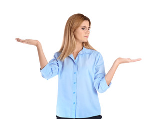 Portrait of businesswoman showing balance gesture on white background