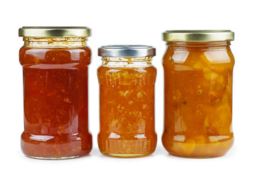 Homemade jam in glass jars isolated on white background