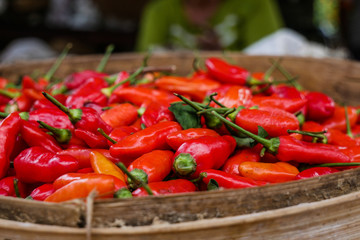 Wooden bowl red chilis