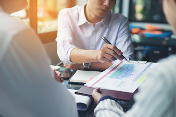 Business team meeting to discuss financial results and to plan the implementation in meeting room