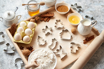 Delicious fresh and healthy ingredients for Christmas gingerbread. Placed on a wooden pastry board. View from above.