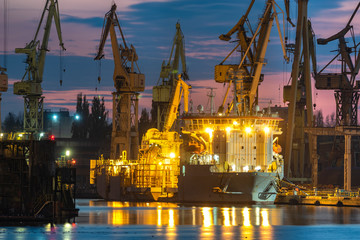 Fototapeta na wymiar industrial areas, shipyard and port after sunset - Szczecin, Poland