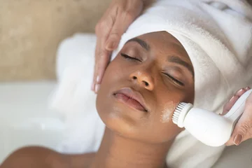Tuinposter Young African-American Woman Spa Treatment Relaxing © terryleewhite