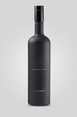 closed matt black bottle of vodka on white background with shadow
