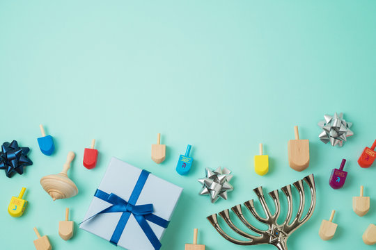 Jewish holiday Hanukkah background with menorah,  gift box and spinning top