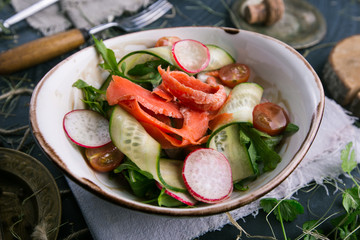 Fresh carrot, cucumber and radish vegetable salad