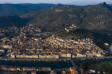 Naklejka premium Aerial view of the beautiful village of Bosa with coloured houses. Bosa is located in the north-west of Sardinia, Italy.