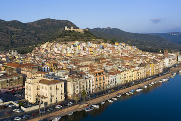 Naklejka premium Aerial view of the beautiful village of Bosa with coloured houses. Bosa is located in the north-west of Sardinia, Italy.