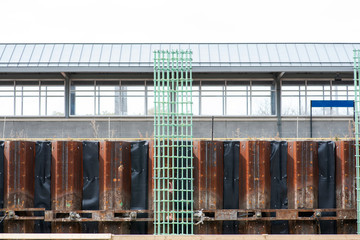 Obraz premium Workers are installing green welded wire steel mesh reinforcement for concrete construction