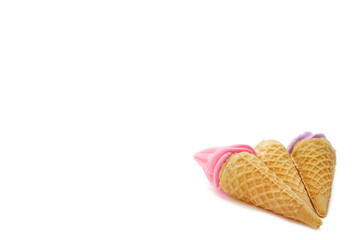 Meringues in mini cone ice cream isolated on white background.