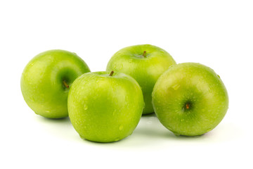 Macro shot of Fresh green apple with water drop isolated on white background.
