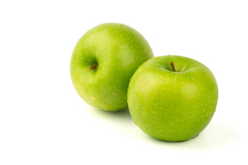 Macro shot of Fresh green apple with water drop isolated on white background.