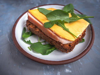 Sandwich with turkey ham and cheese on toasted rye cereal bread