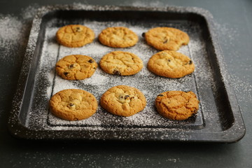 raisin cookies on a flour pan