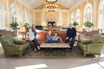 Family posing in a grand open space
