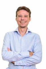 Happy Caucasian businessman smiling and looking at camera
