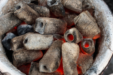 BBQ Grill Pit With Glowing And Flaming Hot Charcoal Briquettes, Food Background Or Texture, Close-Up, Top View