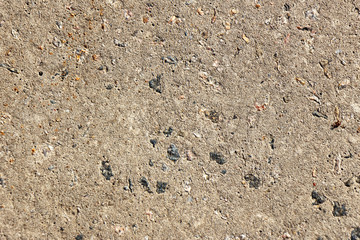 Texture of old weathered, worn concrete pavement.