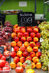 Spain. Barcelona. Sale of nectarines fruit in La Boqueria market