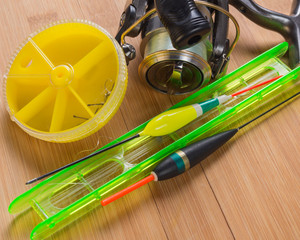 Fishing tackle on a wooden table © liga258