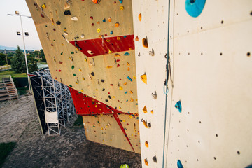Climbing wall with colorful footholds