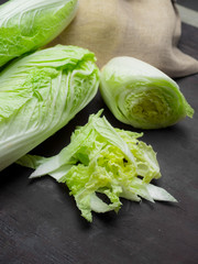 Fototapeta na wymiar Romain lettuce on kitchen board