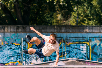 Professional parkour man running over obstacles