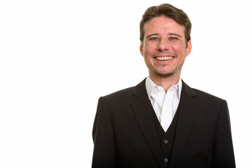 Happy Caucasian businessman smiling while looking at camera