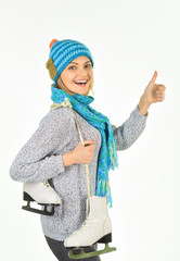 Happy beautiful woman with figure skates. Young woman with ice skates for winter ice skating....