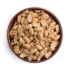 Roasted salted peanuts in wooden bowl on white background,top view
