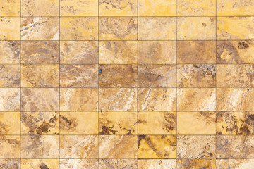 modern wall decorated with rectangles of brown marble
