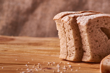 slices of bread and crumbs on wooden table. pleace for text. Copyspace