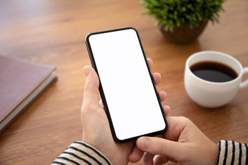 female hand holding touch phone with isolated screen in office