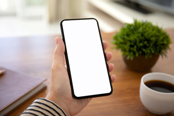 female hands holding touch phone with isolated screen in office