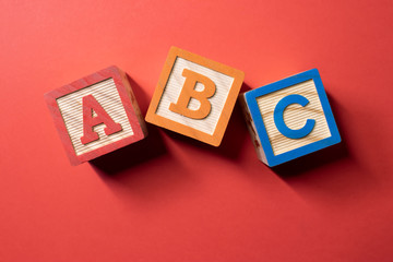 A, B and C wooden blocks - Powered by Adobe