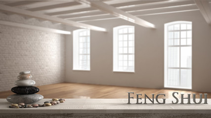 Wooden vintage table shelf with pebble balance and 3d letters making the word feng shui over...