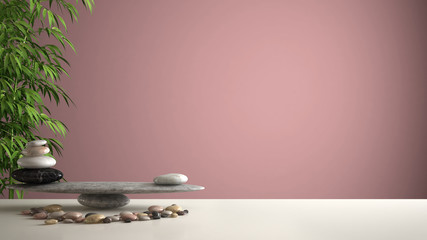 Empty interior design feng shui concept zen idea, white table or shelf with pebble balance and green bamboo, over pink background copy space - obrazy, fototapety, plakaty