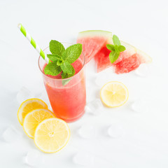 Watermelon mojito with lemon, mint and ice, selective focus