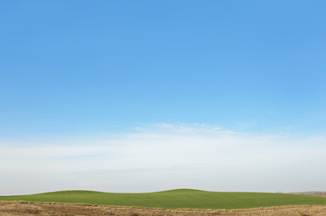 spring landscape sky and green land