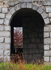 stone arched structure in autumn park